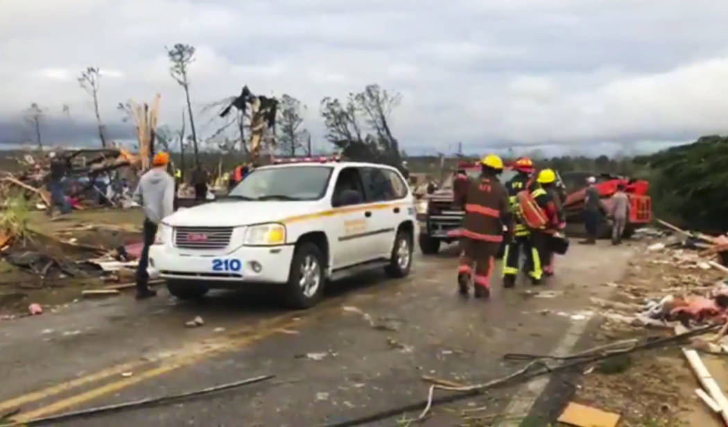 Emergency responders work in the scene amid debris in Lee County, Ala., after what appeared to be a tornado struck in the area Sunday, March 3, 2019. Severe storms destroyed mobile homes, snapped ...
