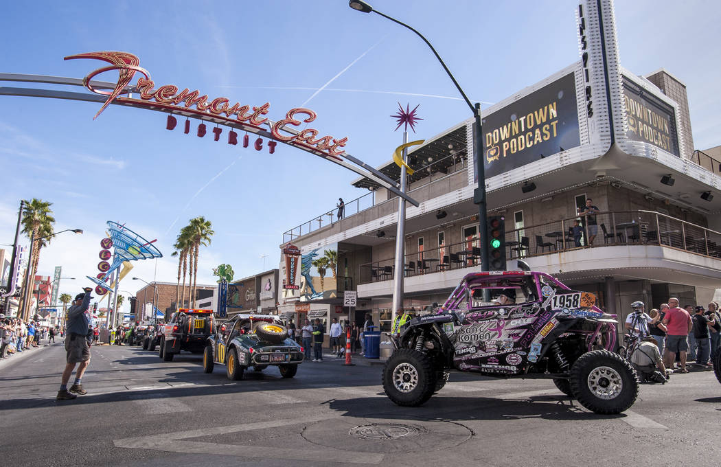 The Mint 400 Vehicle Procession rounds the turn from Las Vegas Boulevard onto East Fremont Street on March 9, 2016. Vehicles are arriving for the official kickoff of the annual Mint 400 off-road r ...