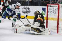 Vegas Golden Knights goaltender Marc-Andre Fleury (29) blocks a shot from Vancouver Canucks right wing Nikolay Goldobin (77) during the second period of an NHL hockey game at T-Mobile Arena in Las ...