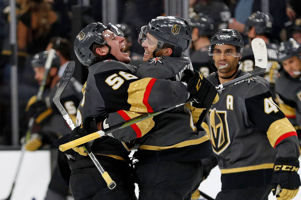 Vegas Golden Knights center Erik Haula, left, celebrates after Vegas Golden Knights center Jonathan Marchessault, right, scored the game-winning goal against the Ottawa Senators during overtime of ...