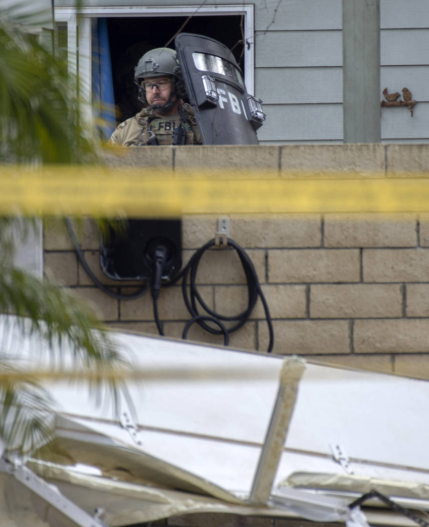 The FBI searches the home of Stephen Beal in Long Beach, Calif., Sunday, March 3, 2019, after taking him into custody in connection with a 2018 bombing at an Aliso Viejo beauty salon that killed h ...