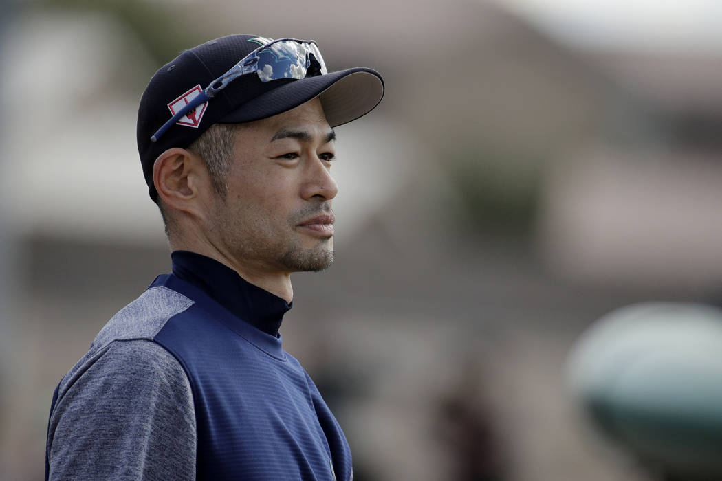 Seattle Mariners' Ichiro Suzuki waits to take batting practice during spring training baseball practice Saturday, Feb. 16, 2019, in Peoria, Ariz. (AP Photo/Charlie Riedel)