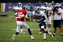 Los Angeles Rams running back Todd Gurley, right, runs a drill with quarterback Jared Goff during a joint NFL football training camp practice at the Baltimore Raven's headquarters, Tuesday, Aug. 7 ...