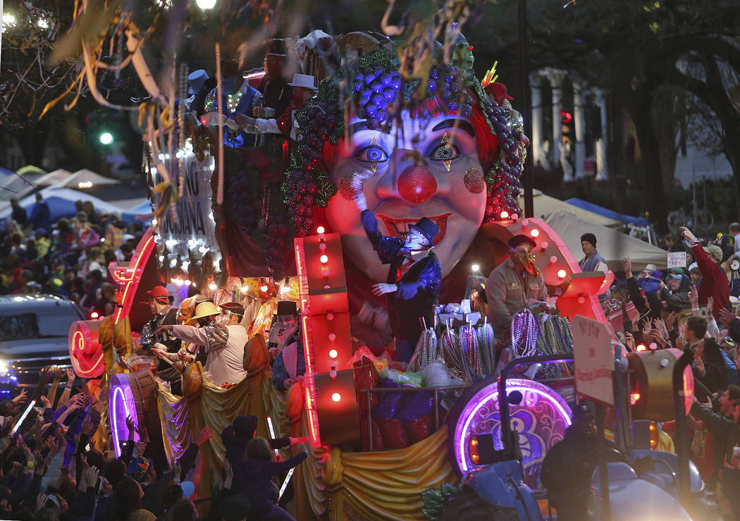 The Title Float rolls down Napoleon Avenue as the 1,600 men of Bacchus present their 32-float Mardi Gras parade entitled "Starring Louisiana" on the Uptown route in New Orleans on Sunday ...