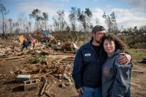 Carol Dean, right, is embraced by David Theo Dean as they sift through the debris of the home Carol shared her husband and David's father, David Wayne Dean, who died when a tornado destroyed the h ...