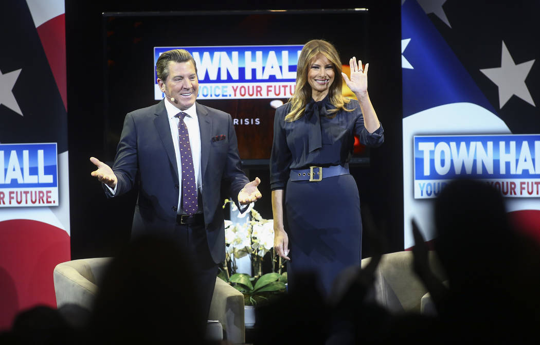 First lady Melania Trump acknowledges the crowd alongside television personality Eric Bolling at a town hall about opioid addiction as part of her Be Best campaign at the Westgate Theater in Las V ...