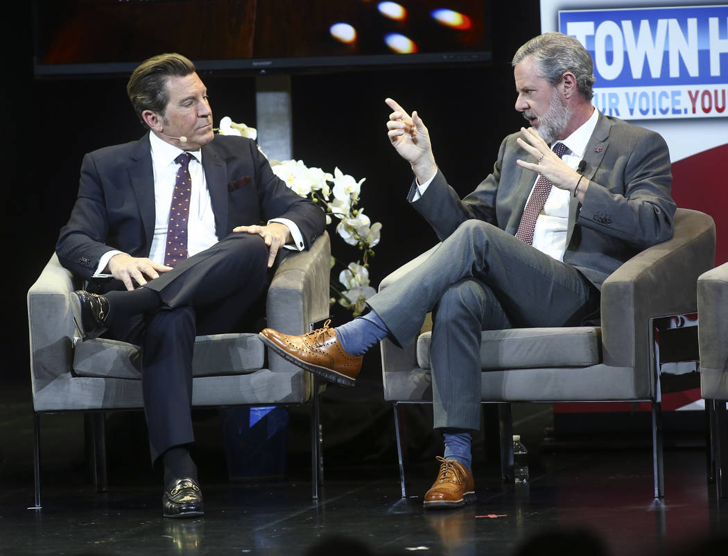 Jerry Falwell Jr., president of Liberty University, right, speaks with television personality Eric Bolling during a town hall about opioid addiction at the Westgate Theater in Las Vegas on Tuesday ...