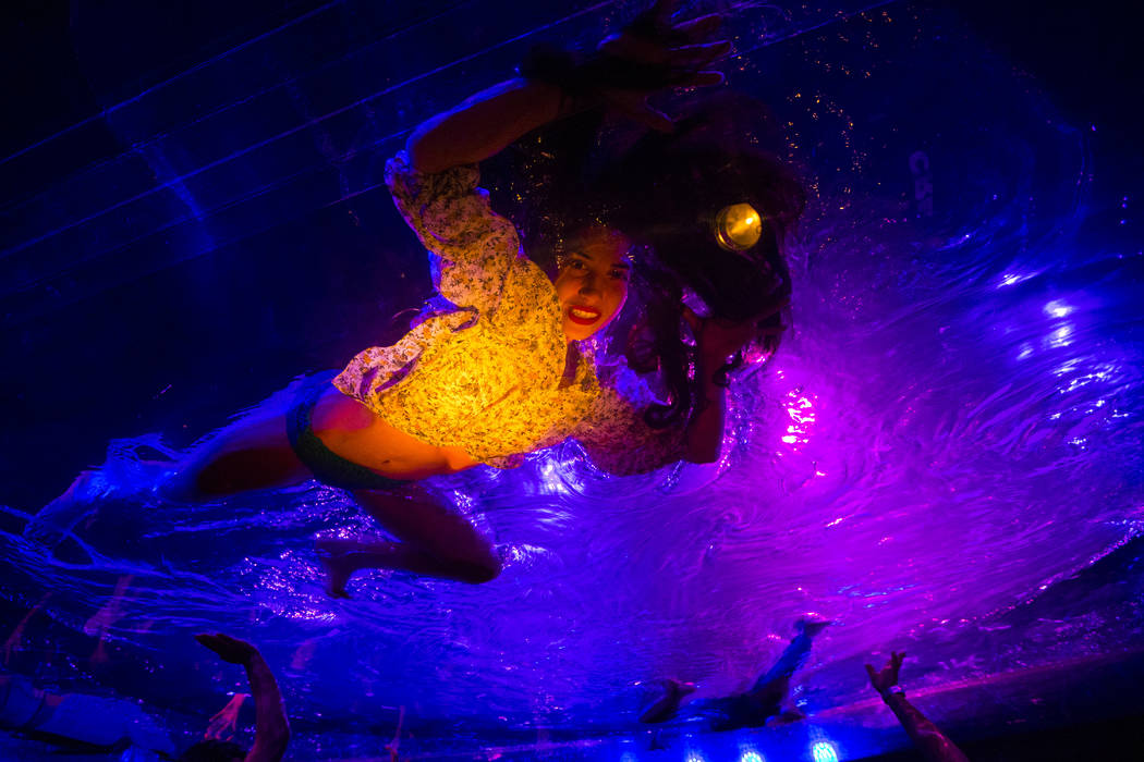 A cast members in "Fuerza Bruta" performs on a mylar suspended pool as part of a media preview at the show's tent outside of the Excalibur in Las Vegas on Wednesday, March 6, 2019. The s ...