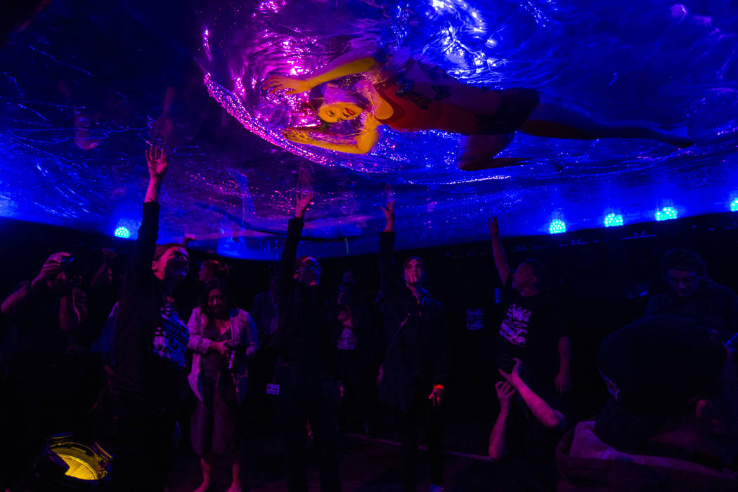 A cast members in "Fuerza Bruta" performs on a mylar suspended pool as part of a media preview at the show's tent outside of the Excalibur in Las Vegas on Wednesday, March 6, 2019. The s ...