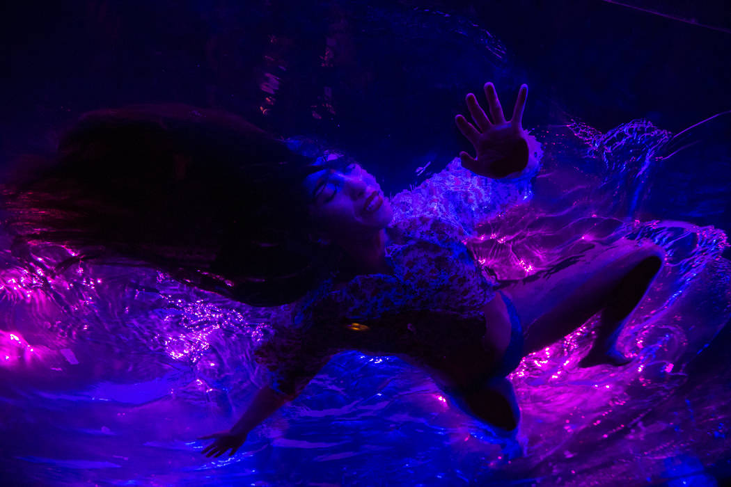 A cast members in "Fuerza Bruta" performs on a mylar suspended pool as part of a media preview at the show's tent outside of the Excalibur in Las Vegas on Wednesday, March 6, 2019. The s ...