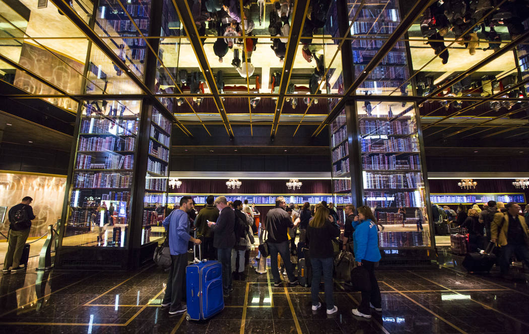 Resort guests wait in line to check-in at the main lobby of The Cosmopolitan of Las Vegas on Thursday, March 7, 2019. (Chase Stevens/Las Vegas Review-Journal) @csstevensphoto