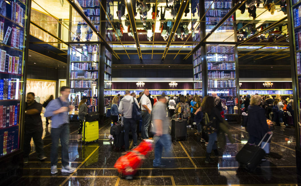 Resort guests wait in line to check-in at the main lobby of The Cosmopolitan of Las Vegas on Thursday, March 7, 2019. (Chase Stevens/Las Vegas Review-Journal) @csstevensphoto