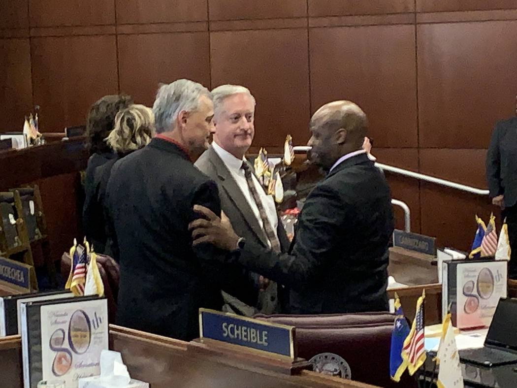 Nevada Senate Majority Leader Kelvin Atkinson, D-Las Vegas, at right, is greeted by GOP Senate Minority Leader James Settelmeyer and GOP Senate