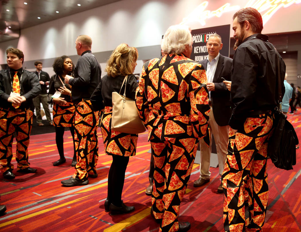 Pat Spaulding of Spaulding & Associates, Inc., of Brighton Michigan, in suit, talks to his Cheese Guys team at the International Pizza Expo at the Las Vegas Convention Center Tuesday, March 5, 201 ...