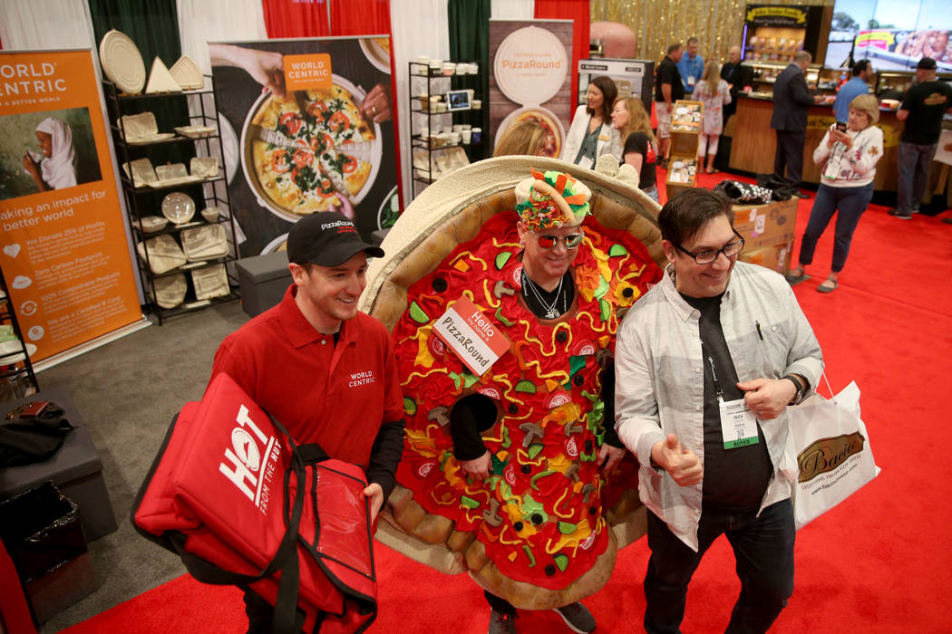 Nick Seretis of Norfolk, Virginia, right, poses with Jim Capalbo, left, and Tom Peske of World Centric in Petaluma, California at International Pizza Expo at the Las Vegas Convention Center Tuesda ...