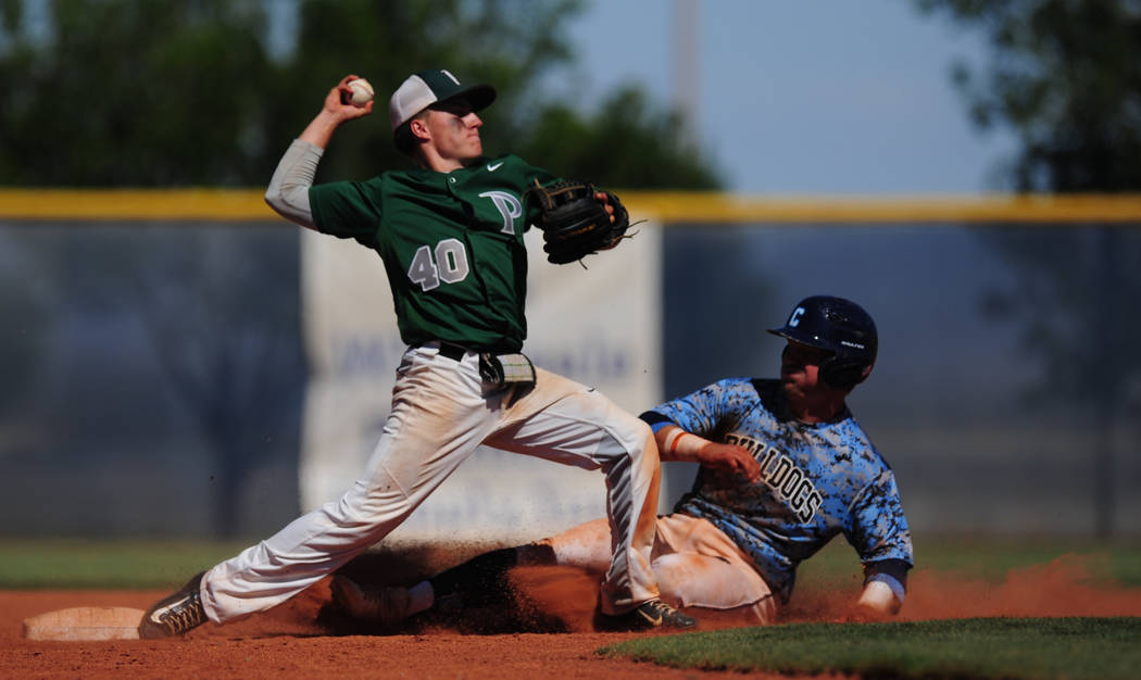 Palo Verde second baseman Nate Bartlett turns a double play as Centennial base runner Austin Kryszczuk slides into second base in the sixth inning of the 2018 NIAA Class 4A Sunset Region Champions ...