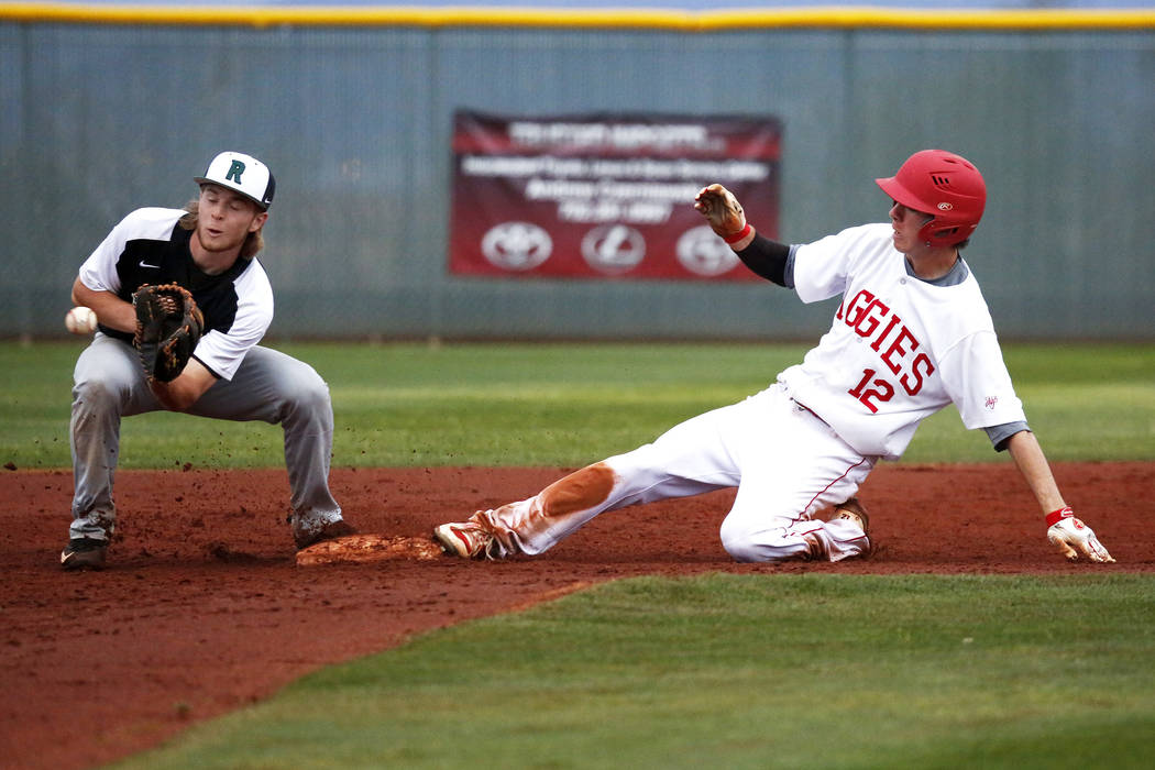Arbor View Aggies' Jesse Pierce (12) slides into second base during a game against the Rancho Rams at Desert Oasis High School in Las Vegas on Saturday, March 10, 2018. The Rams won 10-4. Andrea C ...