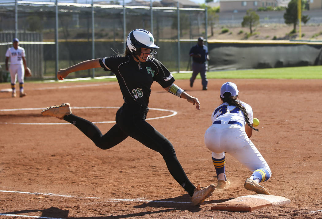 Palo Verde's Makena Martin (15) makes it to first base against Sierra Vista's Holarose Nakayama (37) during a Sunset Region softball tournament game at Palo Verde High School in Las Vegas on Thurs ...