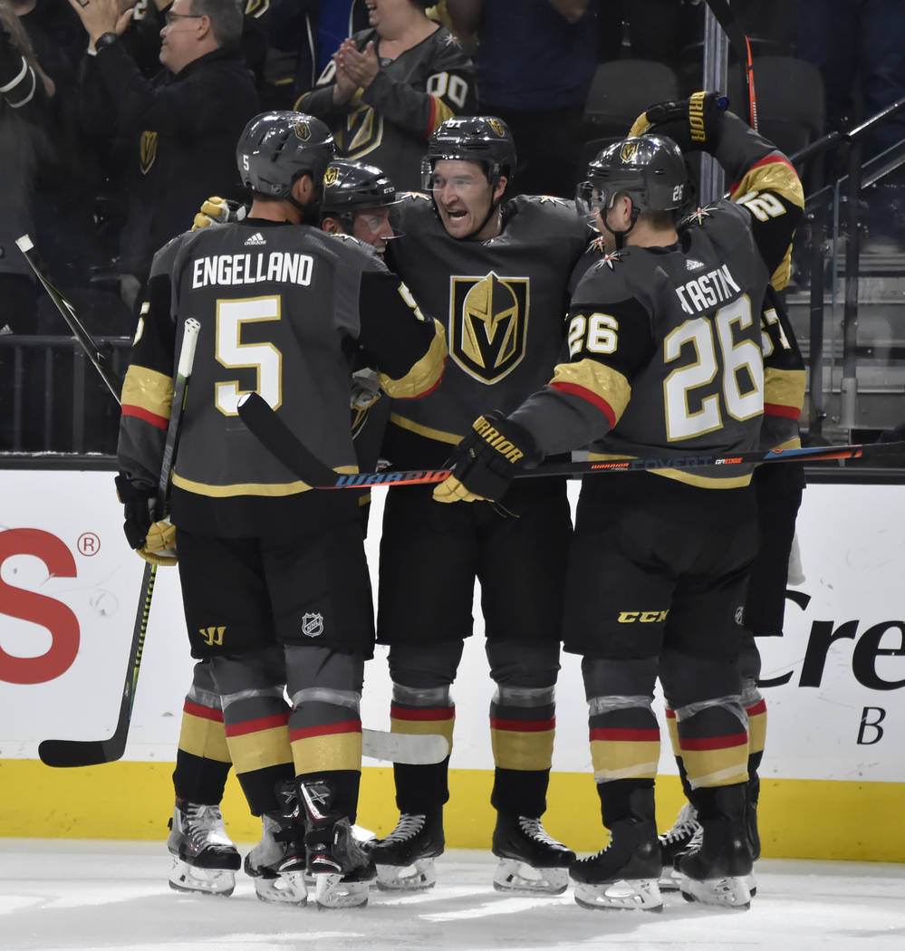 Vegas Golden Knights defenseman Deryk Engelland (5), defenseman Nate Schmidt (88), right wing Mark Stone (61), left wing Max Pacioretty (67) and center Paul Stastny (26) celebrate Pacioretty' goal ...