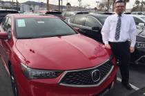 Findlay Acura sales manager Brian Castaneda stands alongside the 2019 Acura TLX A-Spec at the Valley Automall in Henderson. (Findlay)