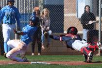 Centennial's Anthony Martinez, left, avoids a tag from Liberty's catcher James Katona as he scores the winning run during their baseball game at Centennial High School on Thursday, March 7, 2019, ...