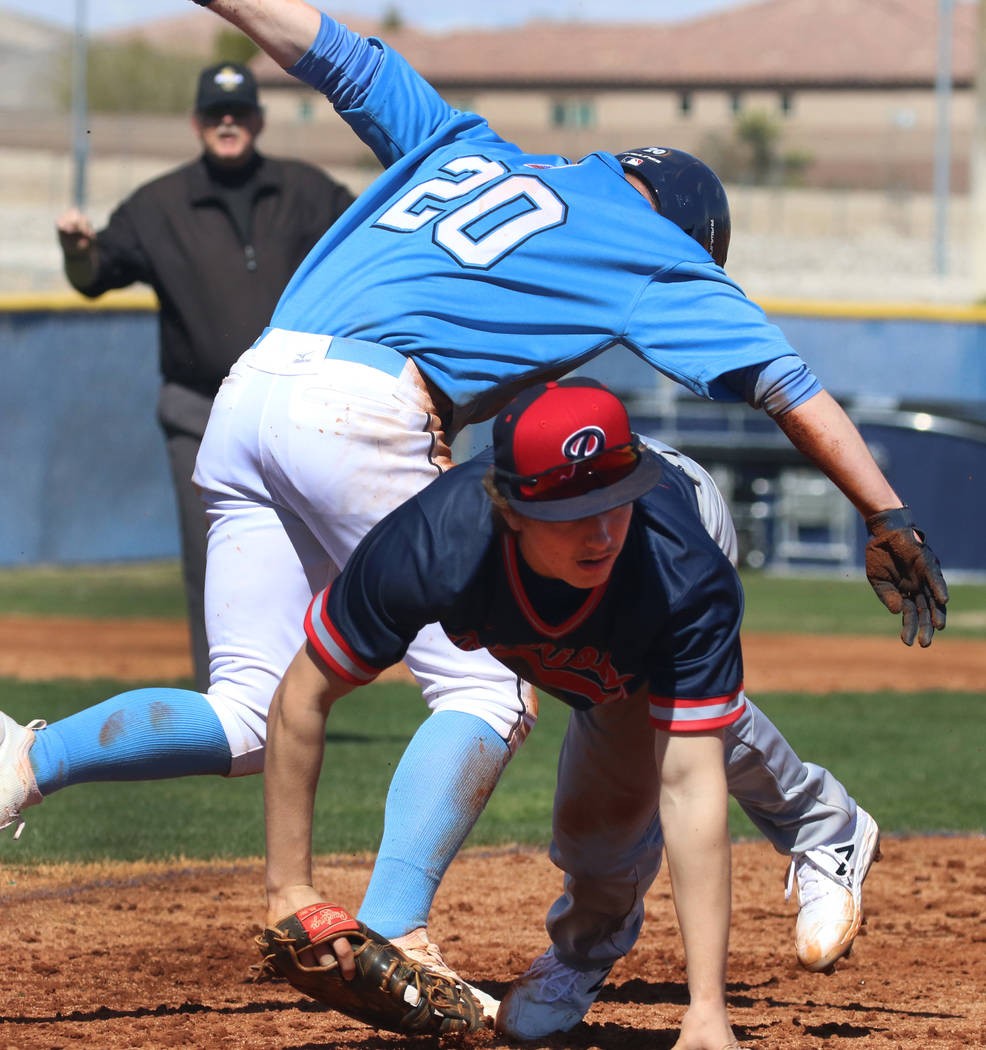 Centennial's Travis Rice (20) and Liberty's Ethan Safier collide at second during their baseball game at Centennial High School on Thursday, March 7, 2019, in Las Vegas. Centennial won 5-4. (Bizua ...