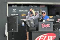 Tim Klinger, of Boulder City, holds up two of the five bass that brought his tournament total to 34-pounds, 12-ounces and gave him the victory on Championship Saturday of the Costa FLW Series West ...