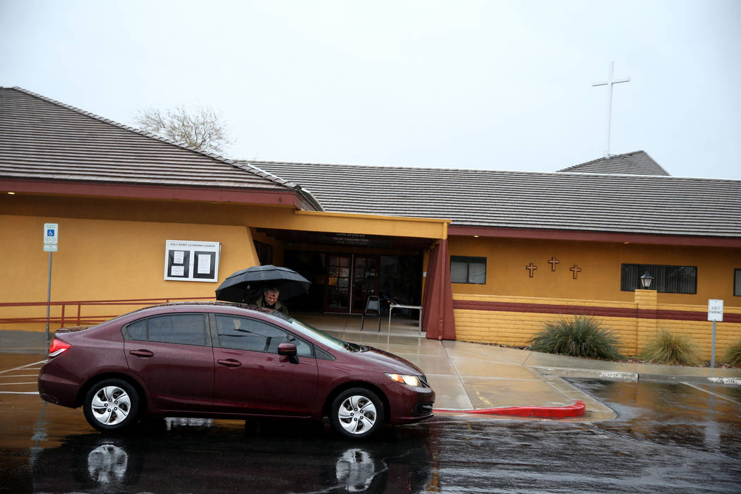 Pastor Jeremy Nausin gives ashes to a driver at Holy Spirit Lutheran Church during an "Ashes to Go" drive-thru Ash Wednesday blessing at the Las Vegas church, Wednesday, March 6, 2019. (K.M. Canno ...