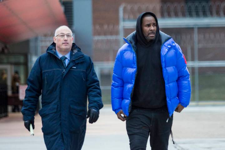 FR. Kelly, right, walks out of Cook County Jail with his defense attorney, Steve Greenberg after posting $100,000 bail in Chicago, Feb. 25, 2019. In his first interview since being charged with se ...
