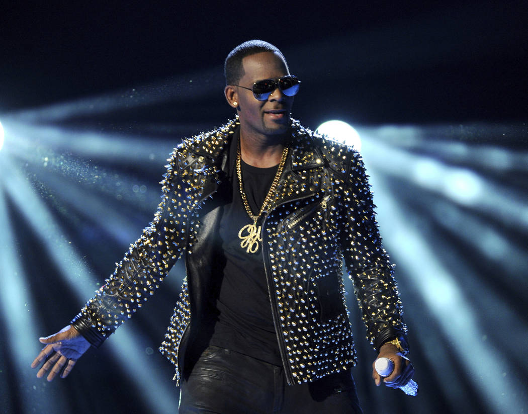 R. Kelly performs at the BET Awards in Los Angeles, June 30, 2013. In his first interview since being charged with sexually abusing four people, R. Kelly says he "didn't do this stuff" and he's "f ...