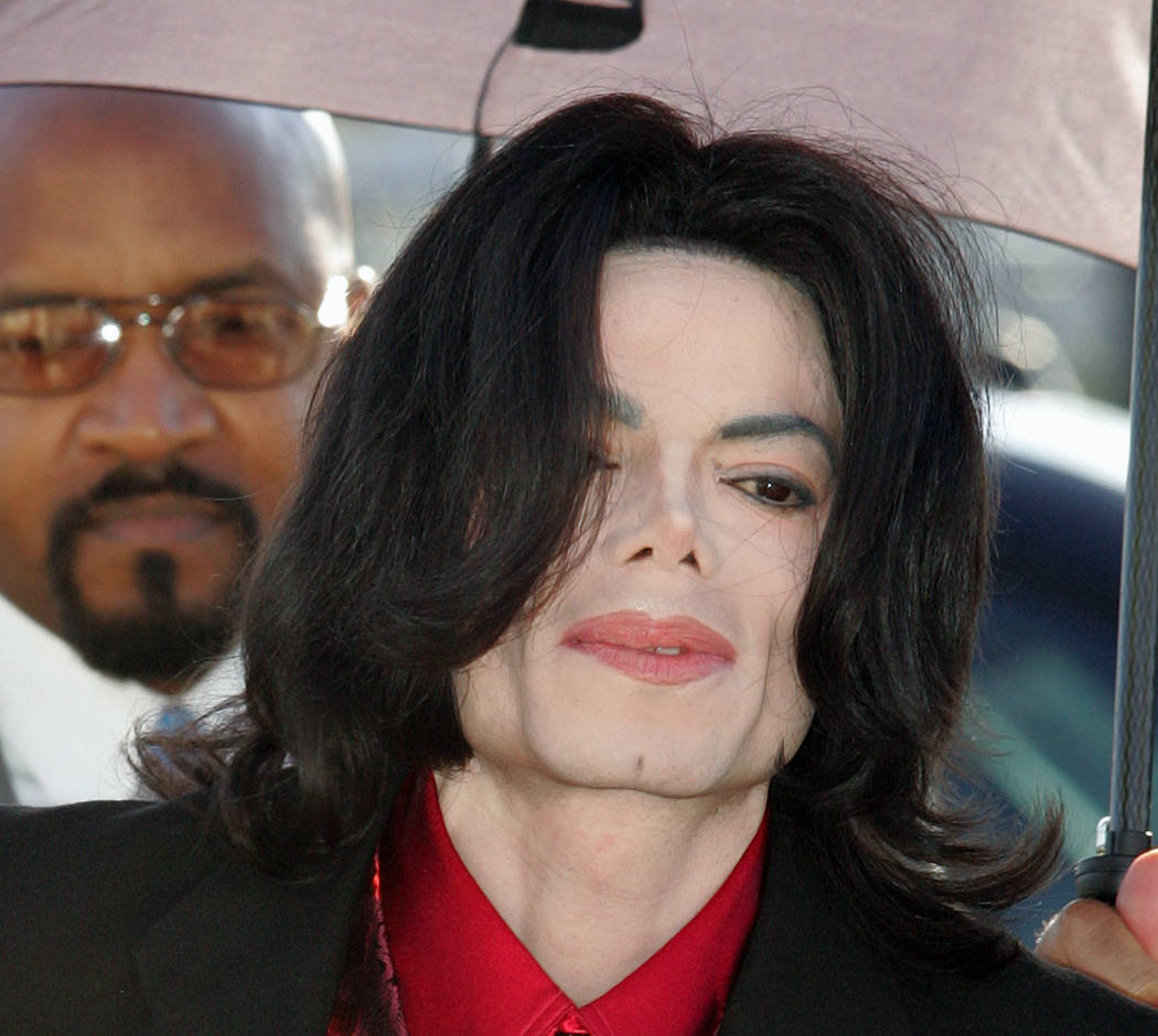 In this Feb. 23, 2005 file photo, Michael Jackson arrives at Santa Barbara County Superior Court in Santa Maria, Calif. (AP Photo/Carlo Allegri, pool, file)
