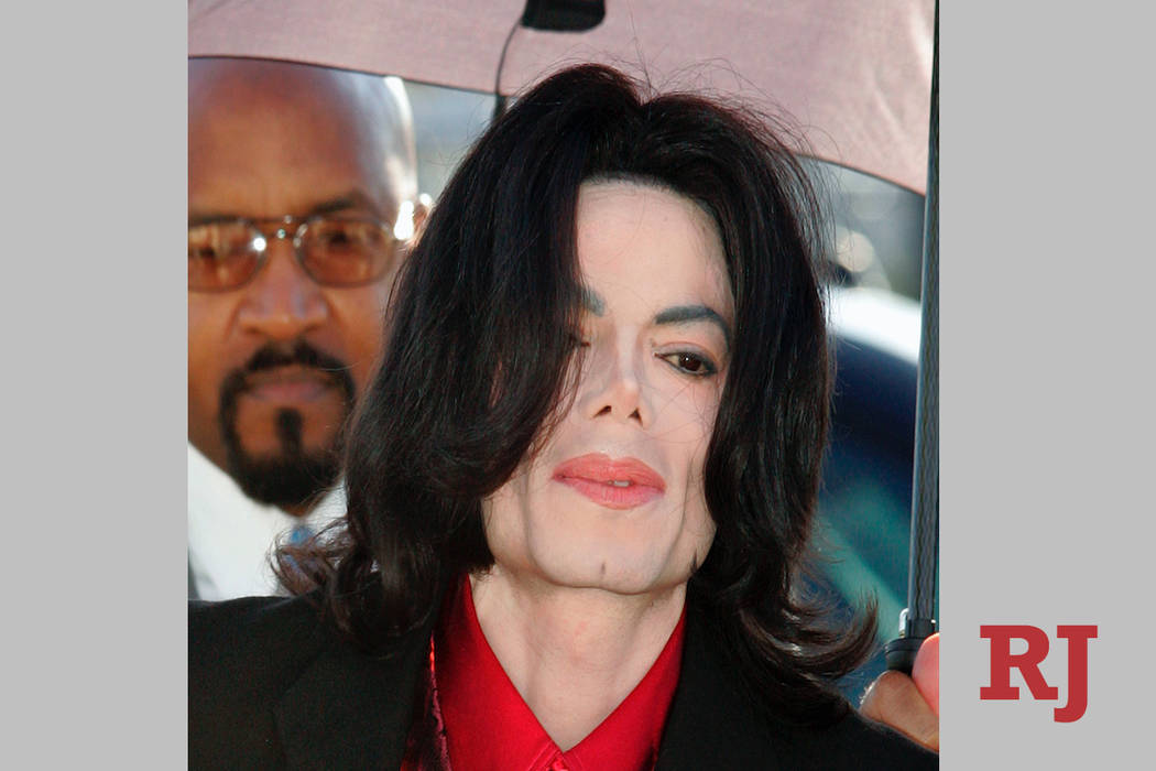 In this Feb. 23, 2005 file photo, Michael Jackson arrives at Santa Barbara County Superior Court in Santa Maria, Calif. (AP Photo/Carlo Allegri, pool, file)