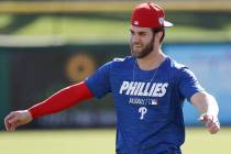 Philadelphia Phillies outfielder Bryce Harper warms up during baseball practice Sunday, March 3, 2019, at Spectrum Field in Clearwater, Fla. (Yong Kim/The Philadelphia Inquirer via AP)