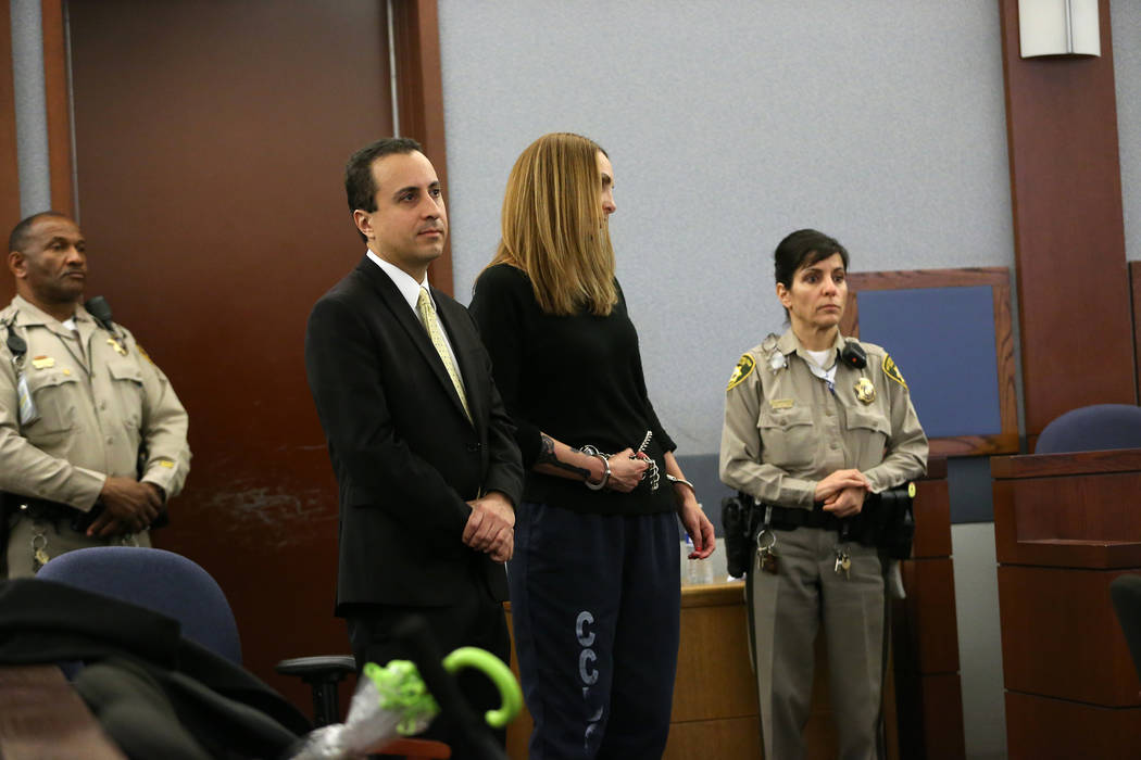 Jailed attorney Alexis Plunkett, center, with her attorney Michael Castillo, left, appears for a court hearing at the Regional Justice Center in Las Vegas, Wednesday, March 6, 2019. (Erik Verduzco ...