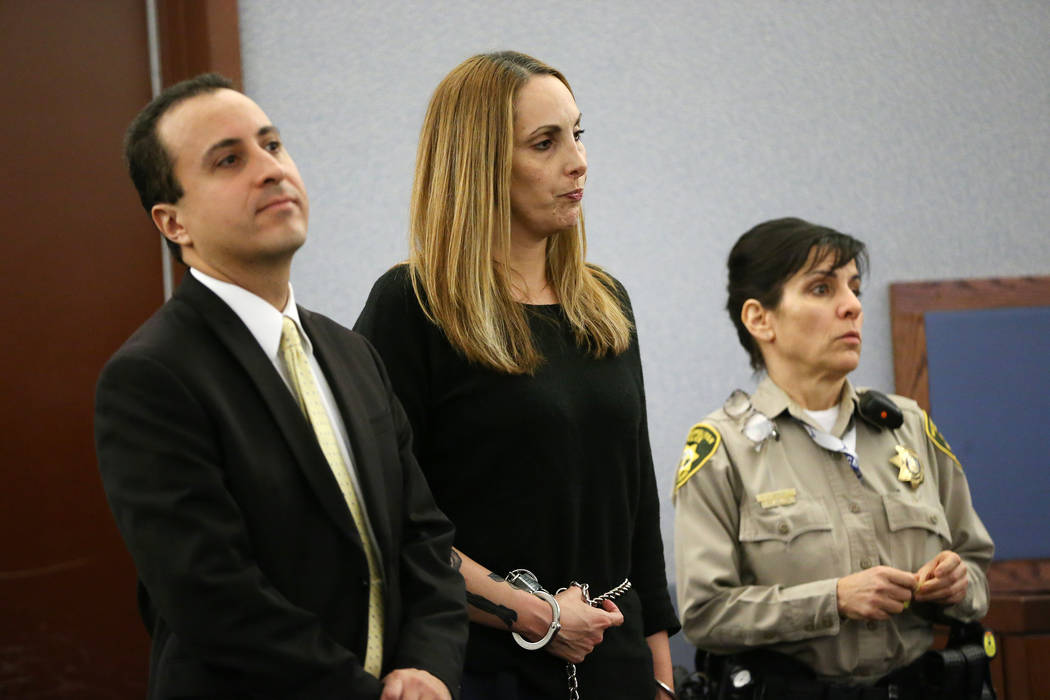 Jailed attorney Alexis Plunkett, center, with her attorney Michael Castillo, left, appears for a court hearing at the Regional Justice Center in Las Vegas on Wednesday, March 6, 2019. (Erik Verduz ...