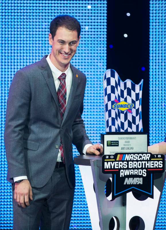 Joey Logano takes photos with the Diamond Performance Award during the NASCAR NMPA Myers Brothers Awards at Encore Theater on Wednesday, Nov. 28, 2018, at Wynn Las Vegas, in Las Vegas. Benjamin Ha ...