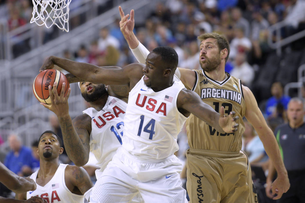 DeMarcus Cousins, left, and Draymond Green of the United States grab a rebound from Andres Nocioni of Argentina during a USA Basketball showcase exhibition game at T-Mobile Arena. (Sam Morris/Las ...