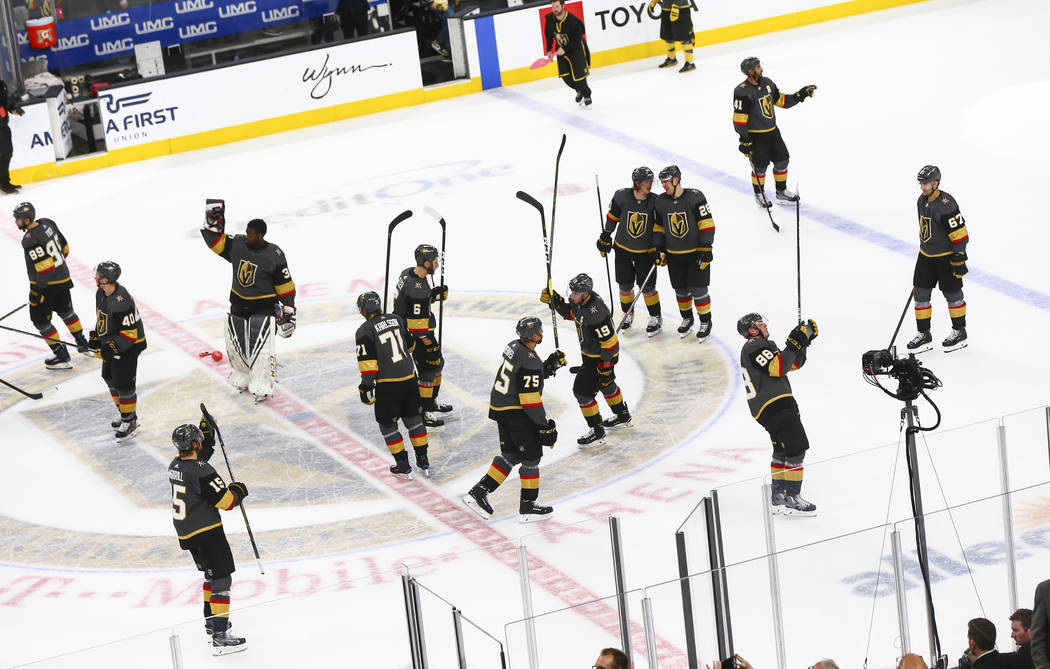 Golden Knights players celebrate their win over the Calgary Flames in an NHL hockey game at T-Mobile Arena in Las Vegas on Wednesday, March 6, 2019. (Chase Stevens/Las Vegas Review-Journal) @csste ...