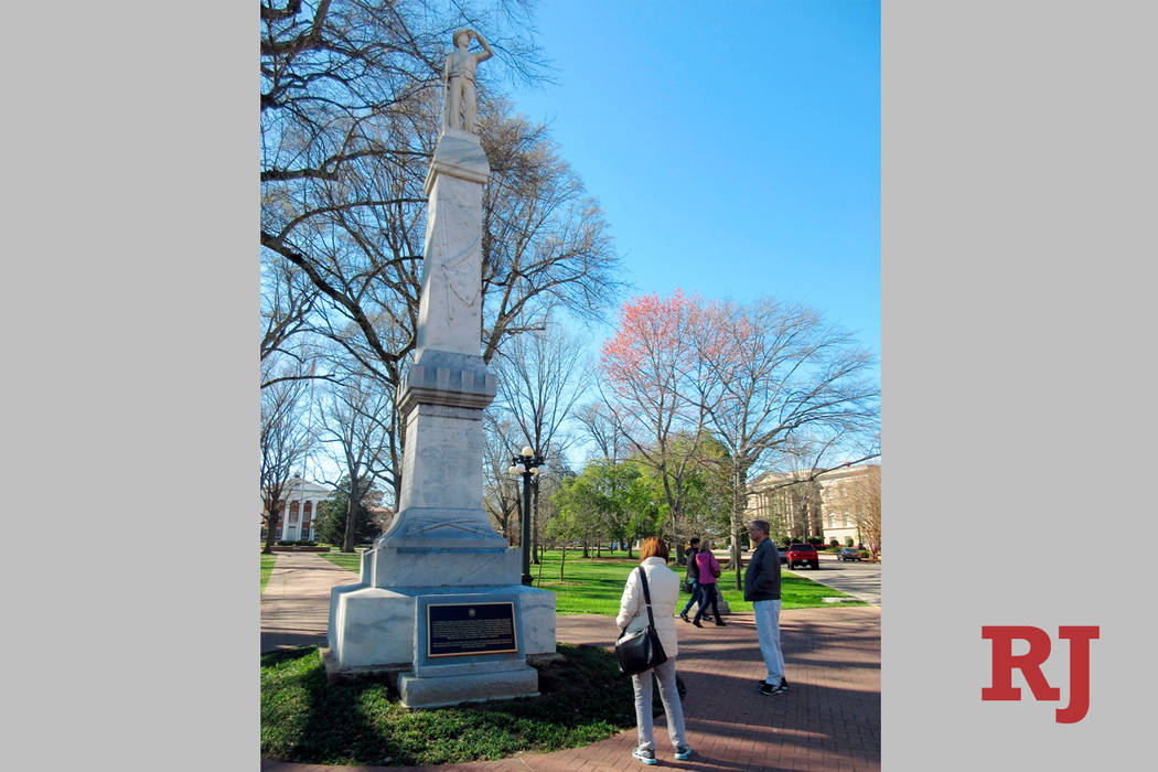 This March 12, 2017, file photo shows a statue of a Confederate soldier on the campus of the University of Mississippi in Oxford, Miss. University of Mississippi student government groups are call ...