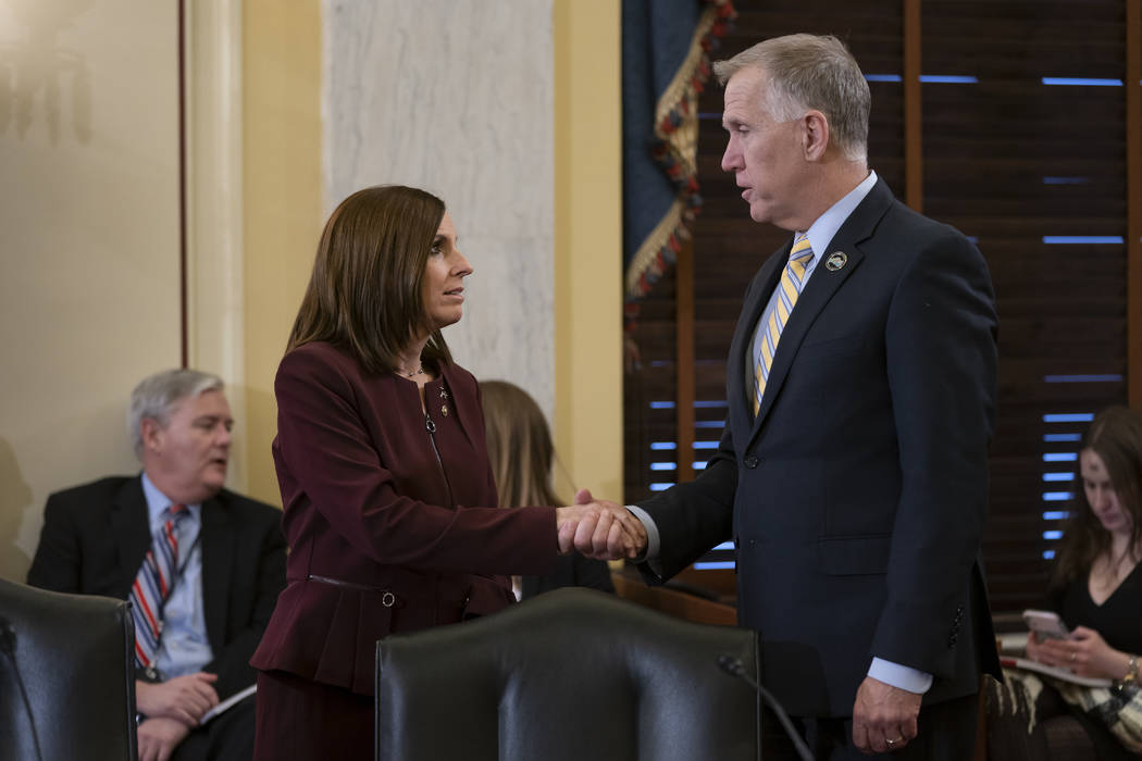 Sen. Martha McSally, R-Ariz., left, is greeted by Sen. Thom Tillis, R-N.C., chairman of the Senate Armed Services Subcommittee on Personnel, as she prepares to testify about her experience with se ...