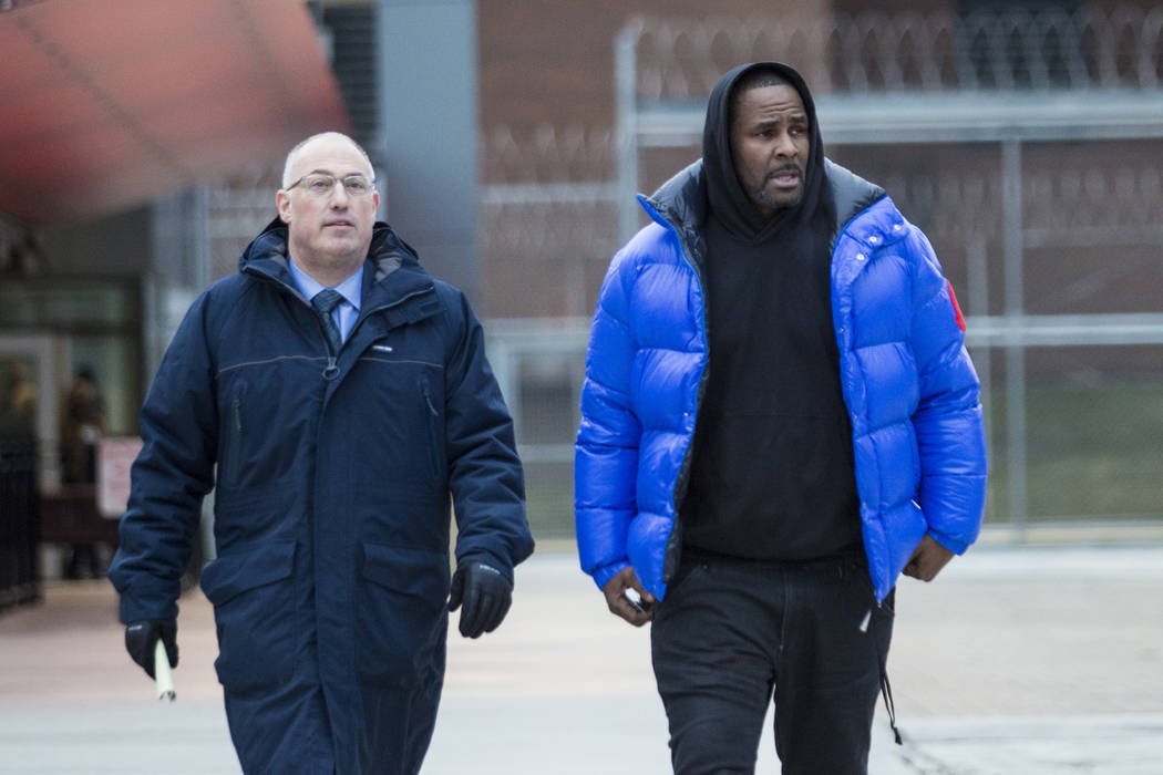 In this Monday, Feb. 25, 2019 file photo, R. Kelly walks out of Cook County Jail with his defense attorney, Steve Greenberg, after posting $100,000 bail, in Chicago. (Ashlee Rezin/Chicago Sun-Time ...