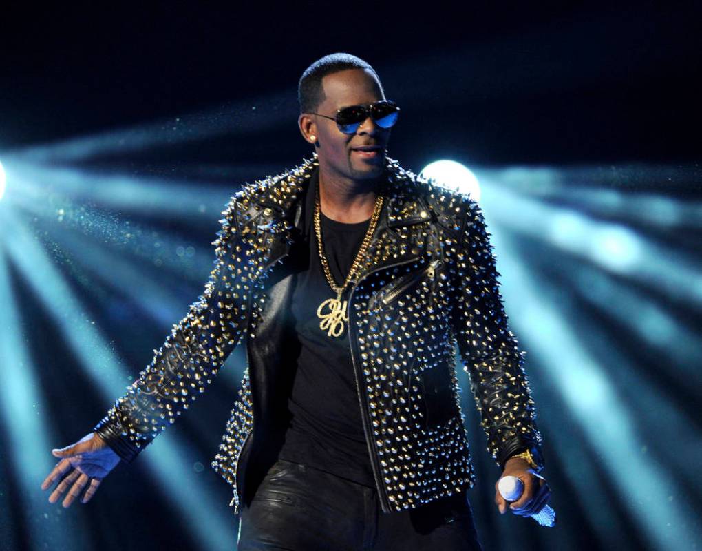 FILE - In this June 30, 2013 file photo, R. Kelly performs at the BET Awards in Los Angeles. In his first interview since being charged with sexually abusing four people, including three underage ...