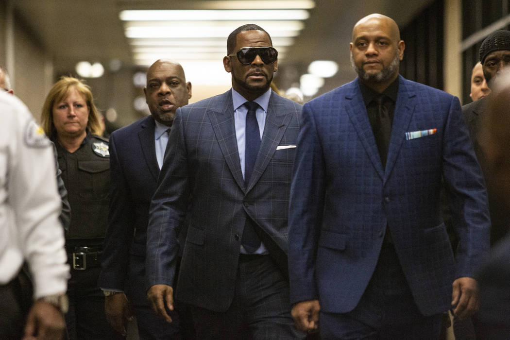 Musician R. Kelly arrives at the Daley Center for a hearing in his child support case at the Daley Center, Wednesday, March 6, 2019, in Chicago. Kelly was charged last month with sexually abusing ...