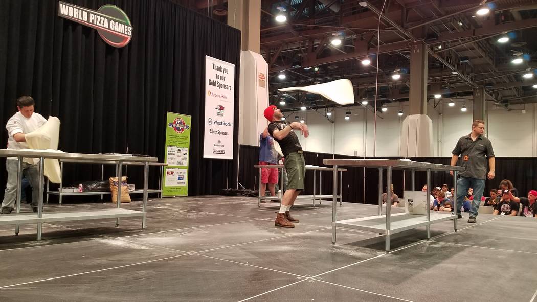 Competitors tossed and spun their dough to stretch it as large as possible in the Largest Stretch contest at the International Pizza Expo on Wednesday, March 6, 2019, at the Las Vegas Convention C ...