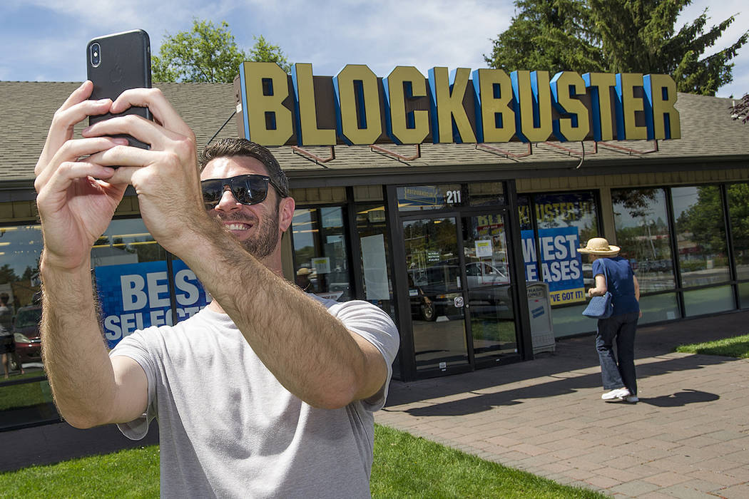 In this July 13, 2018 file photo, Scott Thornton takes a selfie in front of the Bend, Ore., Blockbuster. (Ryan Brennecke /The Bulletin via AP, File)