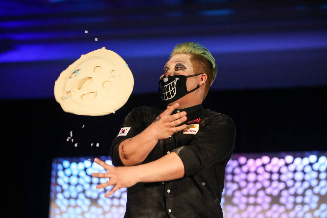 Juntae Jin competes in the dough-tossing championship of the International Pizza Expo at the Las Vegas Convention Center in Las Vegas, Wednesday, March 6, 2019. (Caroline Brehman/Las Vegas Review- ...