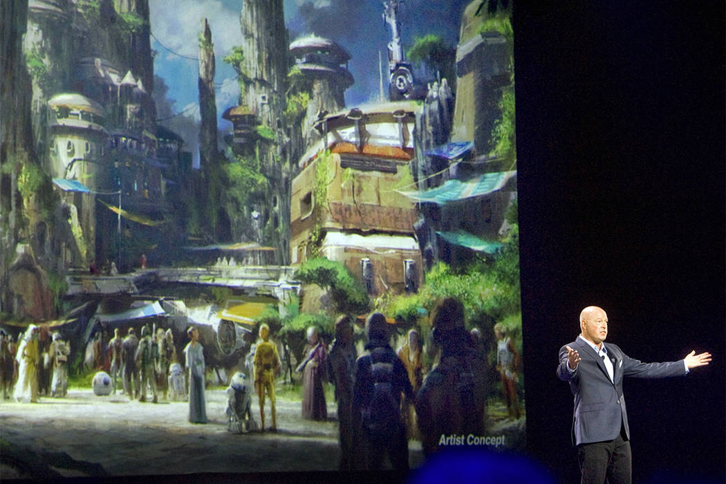 Bob Chapek, chairman of Walt Disney Parks and Resorts, speaks in front of concept art of the newly announced Star Wars Land, Aug. 15, 2015. Disney CEO Bob Iger said Tuesday, Feb. 7, 2017, the comp ...