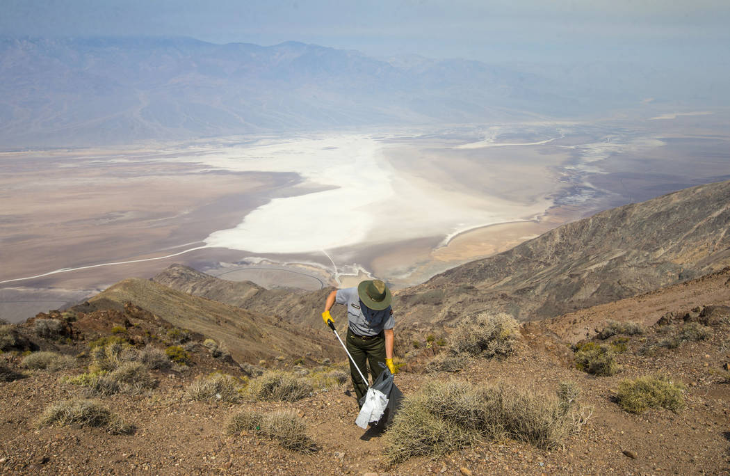 Death Valley National Park custodian Terry Eddington picks up trash at Dante's View in Death Valley National Park, Calif., on Tuesday, Aug. 7, 2018. (Chase Stevens Las Vegas Review-Journal @csstev ...