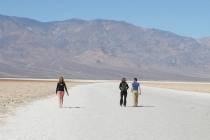 Visitors walk the salt flats at Badwater Basin in Death Valley National Park in California. (Las Vegas Review-Journal)