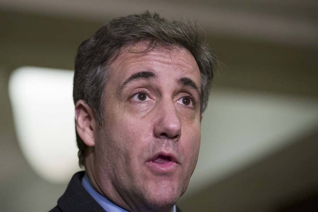 Michael Cohen, President Donald Trump's former lawyer, speaks as he departs after testifying before a closed-door session of the House Intelligence Committee on Capitol Hill, in Washington, March ...